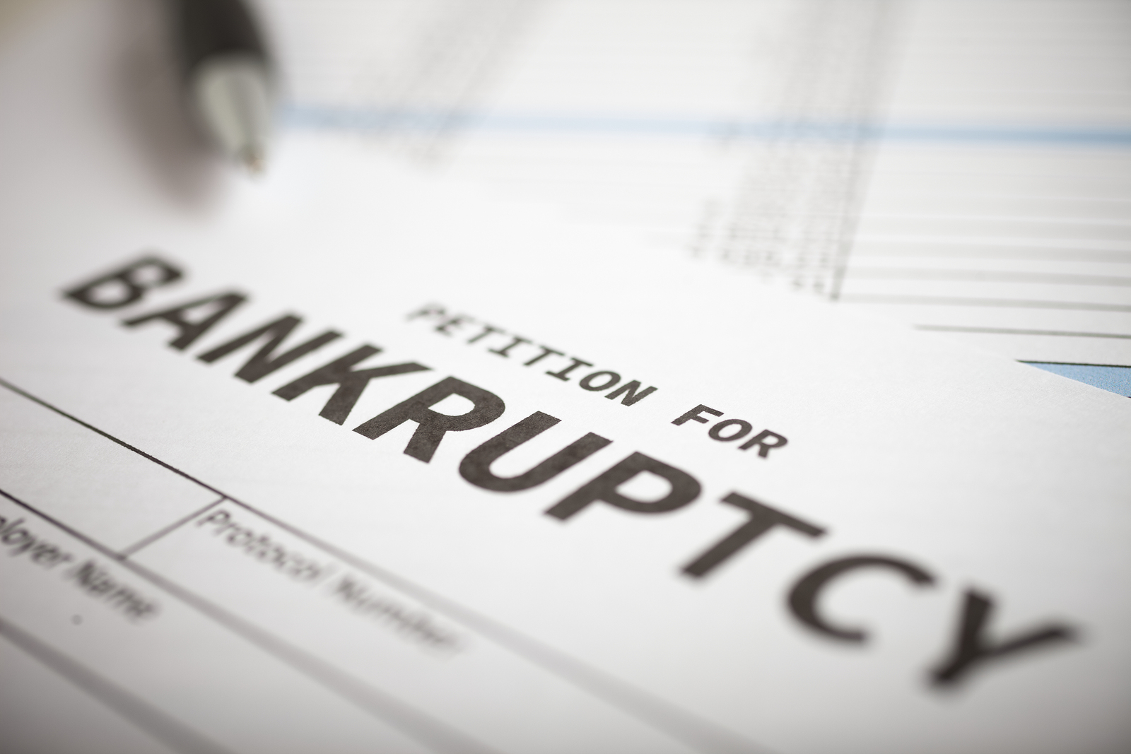 Bankruptcy paperwork on a table waiting to be filled out